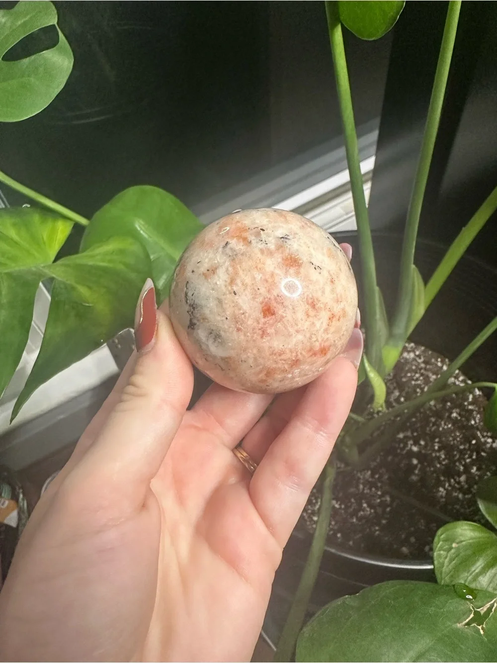 Orange sunstone crystals sphere with banding